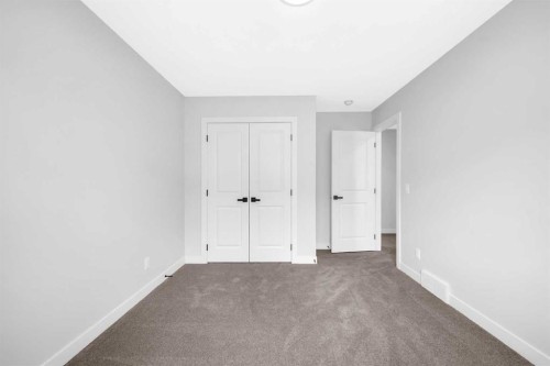 55 Amblehurst Link Nw, Calgary, AB - Indoor Photo Showing Other Room