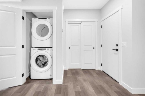 55 Amblehurst Link Nw, Calgary, AB - Indoor Photo Showing Laundry Room
