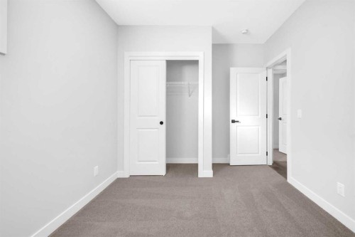 55 Amblehurst Link Nw, Calgary, AB - Indoor Photo Showing Other Room