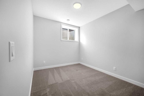 55 Amblehurst Link Nw, Calgary, AB - Indoor Photo Showing Other Room