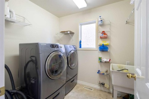 103 Riverside Way Se, Calgary, AB - Indoor Photo Showing Laundry Room