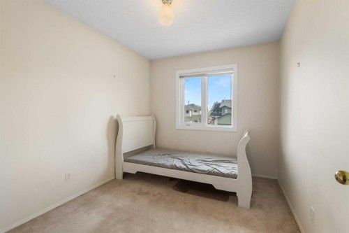 103 Riverside Way Se, Calgary, AB - Indoor Photo Showing Bedroom