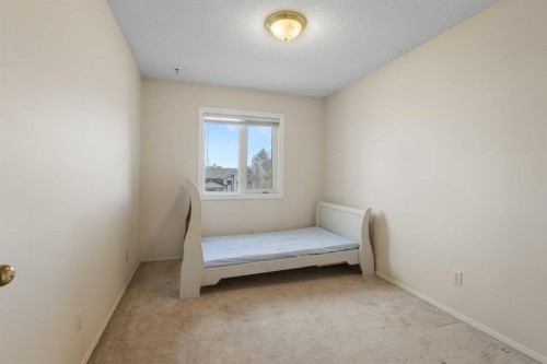 103 Riverside Way Se, Calgary, AB - Indoor Photo Showing Bedroom