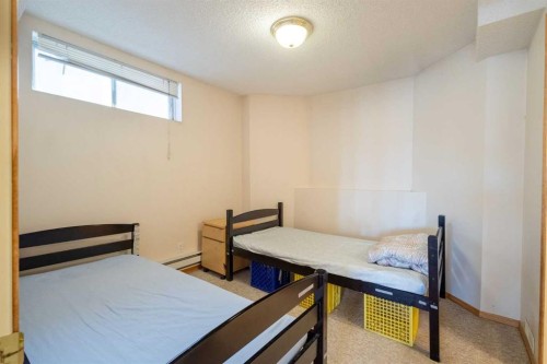 103 Riverside Way Se, Calgary, AB - Indoor Photo Showing Bedroom