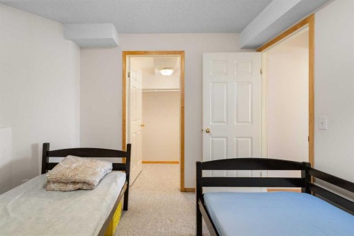 103 Riverside Way Se, Calgary, AB - Indoor Photo Showing Bedroom