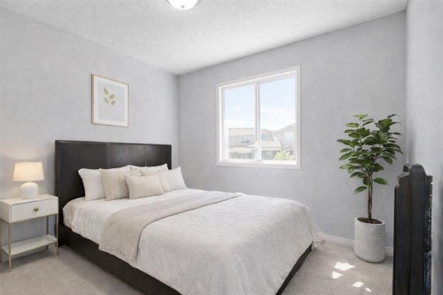 83 Luxstone Crescent Sw, Airdrie, AB - Indoor Photo Showing Bedroom