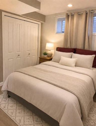 83 Luxstone Crescent Sw, Airdrie, AB - Indoor Photo Showing Bedroom