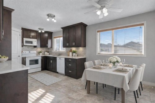 83 Luxstone Crescent Sw, Airdrie, AB - Indoor Photo Showing Dining Room