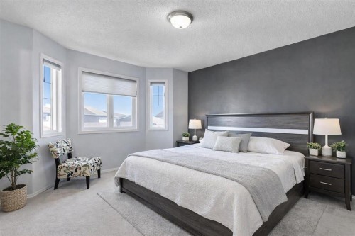 83 Luxstone Crescent Sw, Airdrie, AB - Indoor Photo Showing Bedroom