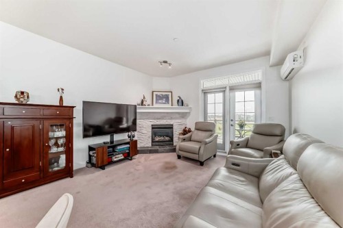 211-1005A Westmount Drive, Strathmore, AB - Indoor Photo Showing Living Room With Fireplace