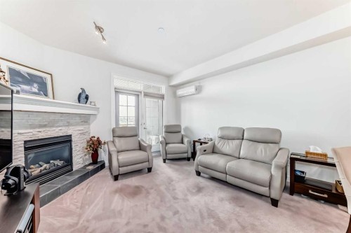 211-1005A Westmount Drive, Strathmore, AB - Indoor Photo Showing Living Room With Fireplace