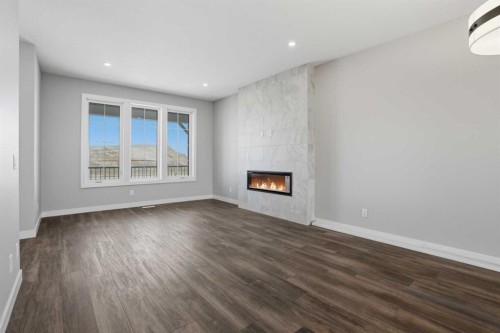 229 Bridgeport Gate, Chestermere, AB - Indoor Photo Showing Other Room With Fireplace
