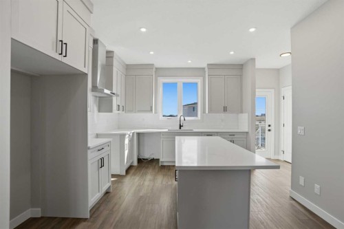 229 Bridgeport Gate, Chestermere, AB - Indoor Photo Showing Kitchen With Upgraded Kitchen