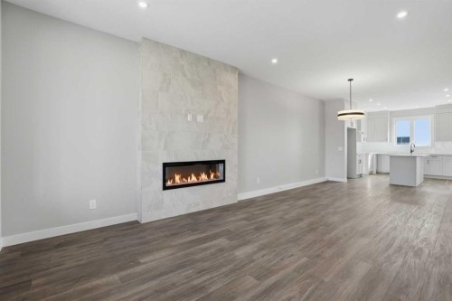 229 Bridgeport Gate, Chestermere, AB - Indoor Photo Showing Living Room With Fireplace
