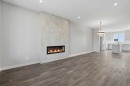 229 Bridgeport Gate, Chestermere, AB  - Indoor Photo Showing Living Room With Fireplace 