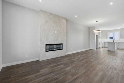 229 Bridgeport Gate, Chestermere, AB - Indoor Photo Showing Living Room With Fireplace
