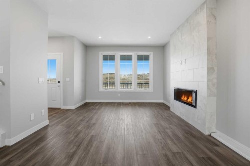 229 Bridgeport Gate, Chestermere, AB - Indoor Photo Showing Living Room With Fireplace