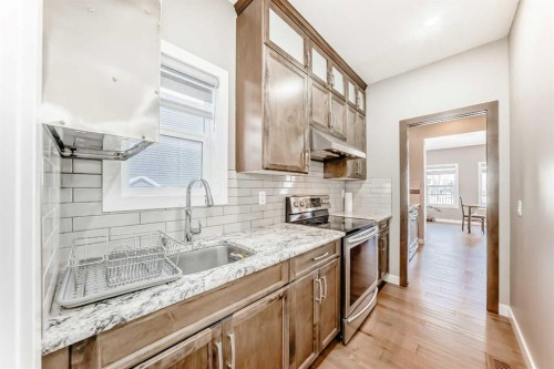 201 Aspenmere Way, Chestermere, AB - Indoor Photo Showing Kitchen With Upgraded Kitchen