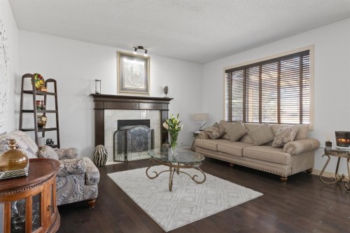 125 Seagreen Manor, Chestermere, AB - Indoor Photo Showing Living Room With Fireplace