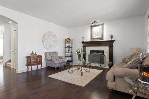 125 Seagreen Manor, Chestermere, AB - Indoor Photo Showing Living Room With Fireplace
