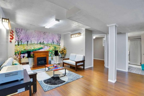 234 Saddlecreek Point Ne, Calgary, AB - Indoor Photo Showing Living Room With Fireplace