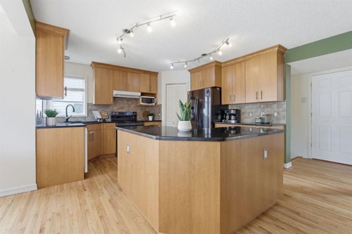412 Sheep River Point, Okotoks, AB - Indoor Photo Showing Kitchen
