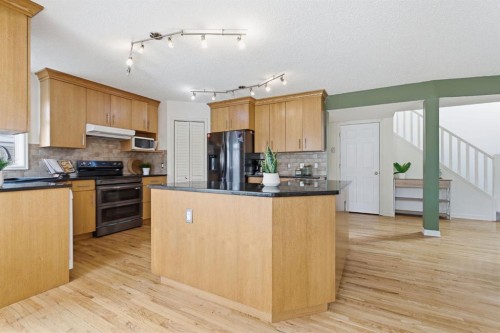 412 Sheep River Point, Okotoks, AB - Indoor Photo Showing Kitchen