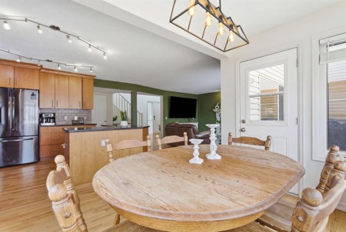 412 Sheep River Point, Okotoks, AB - Indoor Photo Showing Dining Room