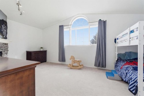 412 Sheep River Point, Okotoks, AB - Indoor Photo Showing Bedroom