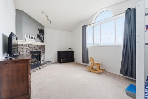 412 Sheep River Point, Okotoks, AB - Indoor With Fireplace