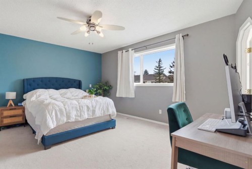 412 Sheep River Point, Okotoks, AB - Indoor Photo Showing Bedroom