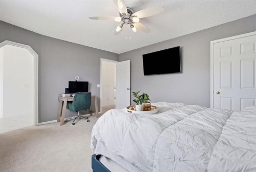 412 Sheep River Point, Okotoks, AB - Indoor Photo Showing Bedroom