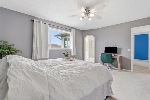 412 Sheep River Point, Okotoks, AB - Indoor Photo Showing Bedroom