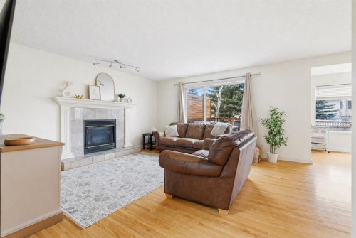 412 Sheep River Point, Okotoks, AB - Indoor Photo Showing Living Room With Fireplace