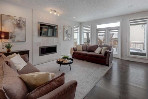 546 Sherwood Boulevard Nw, Calgary, AB - Indoor Photo Showing Living Room With Fireplace