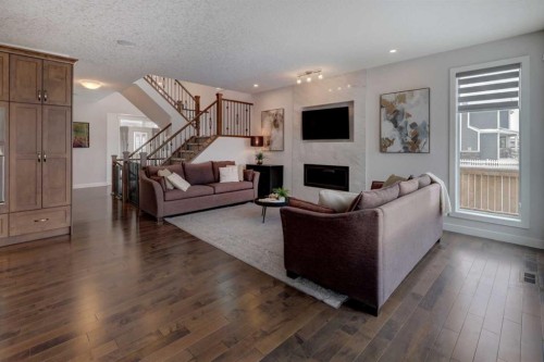 546 Sherwood Boulevard Nw, Calgary, AB - Indoor Photo Showing Living Room With Fireplace