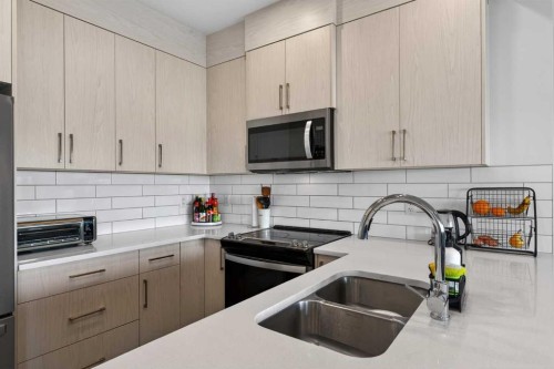 116 Crestridge Common Sw, Calgary, AB - Indoor Photo Showing Kitchen With Double Sink With Upgraded Kitchen