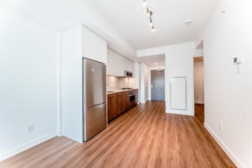 1012-730 2 Avenue Sw, Calgary, AB - Indoor Photo Showing Kitchen With Stainless Steel Kitchen