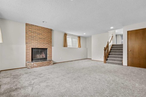 27 Beddington Road Ne, Calgary, AB - Indoor Photo Showing Living Room With Fireplace
