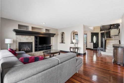 224 Everbrook Way Sw, Calgary, AB - Indoor Photo Showing Living Room With Fireplace