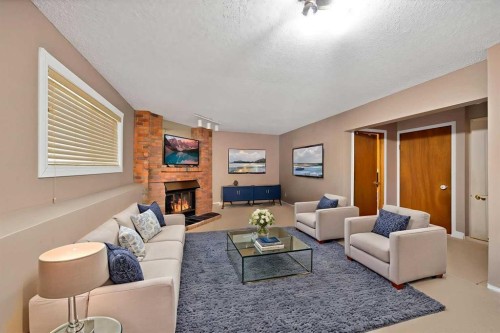 127 Whitehaven Road Ne, Calgary, AB - Indoor Photo Showing Living Room With Fireplace