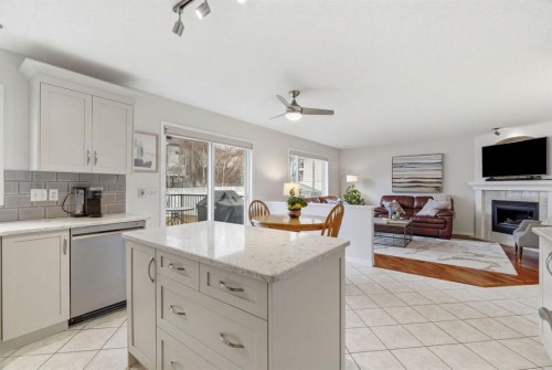 3611 Douglas Ridge Boulevard Se, Calgary, AB - Indoor Photo Showing Kitchen With Fireplace