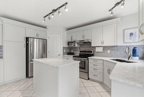 3611 Douglas Ridge Boulevard Se, Calgary, AB - Indoor Photo Showing Kitchen With Stainless Steel Kitchen With Upgraded Kitchen