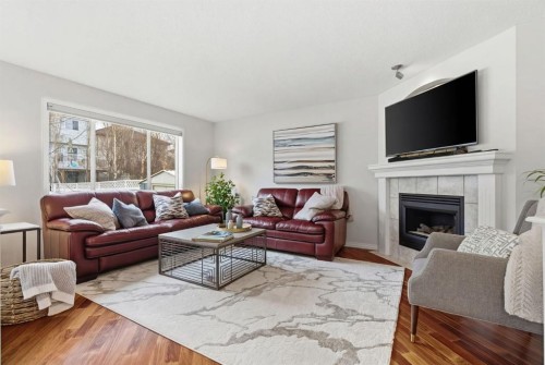 3611 Douglas Ridge Boulevard Se, Calgary, AB - Indoor Photo Showing Living Room With Fireplace