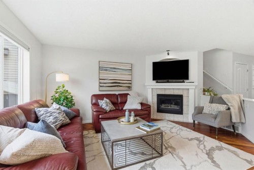 3611 Douglas Ridge Boulevard Se, Calgary, AB - Indoor Photo Showing Living Room With Fireplace