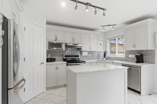 3611 Douglas Ridge Boulevard Se, Calgary, AB - Indoor Photo Showing Kitchen With Stainless Steel Kitchen
