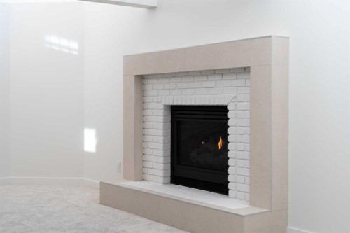 58 Edgevalley Close Nw, Calgary, AB - Indoor Photo Showing Living Room With Fireplace