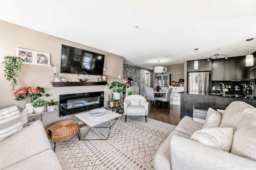 3301-155 Skyview Ranch Way Ne, Calgary, AB - Indoor Photo Showing Living Room With Fireplace
