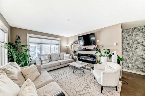 3301-155 Skyview Ranch Way Ne, Calgary, AB - Indoor Photo Showing Living Room With Fireplace