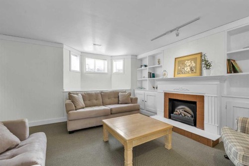60 Inverness Square Se, Calgary, AB - Indoor Photo Showing Living Room With Fireplace